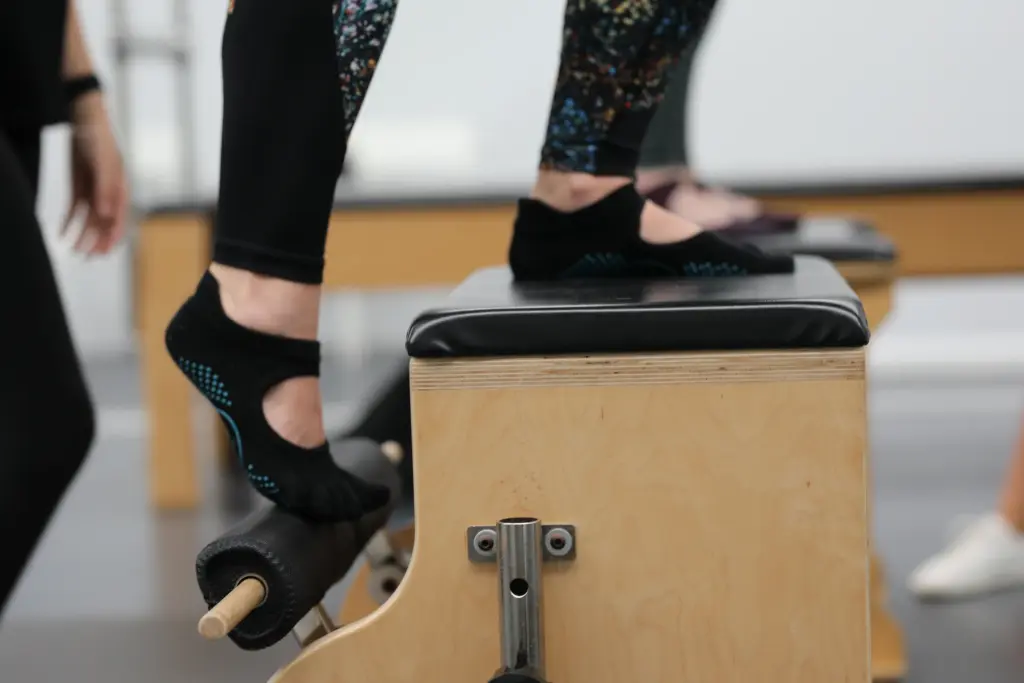 Foot pressing the pedal of a Wunda Chair